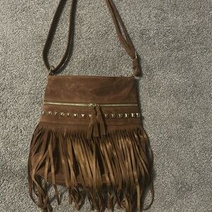 Brand new. Versatile strap, can be made into shoulder bag or crossbody.